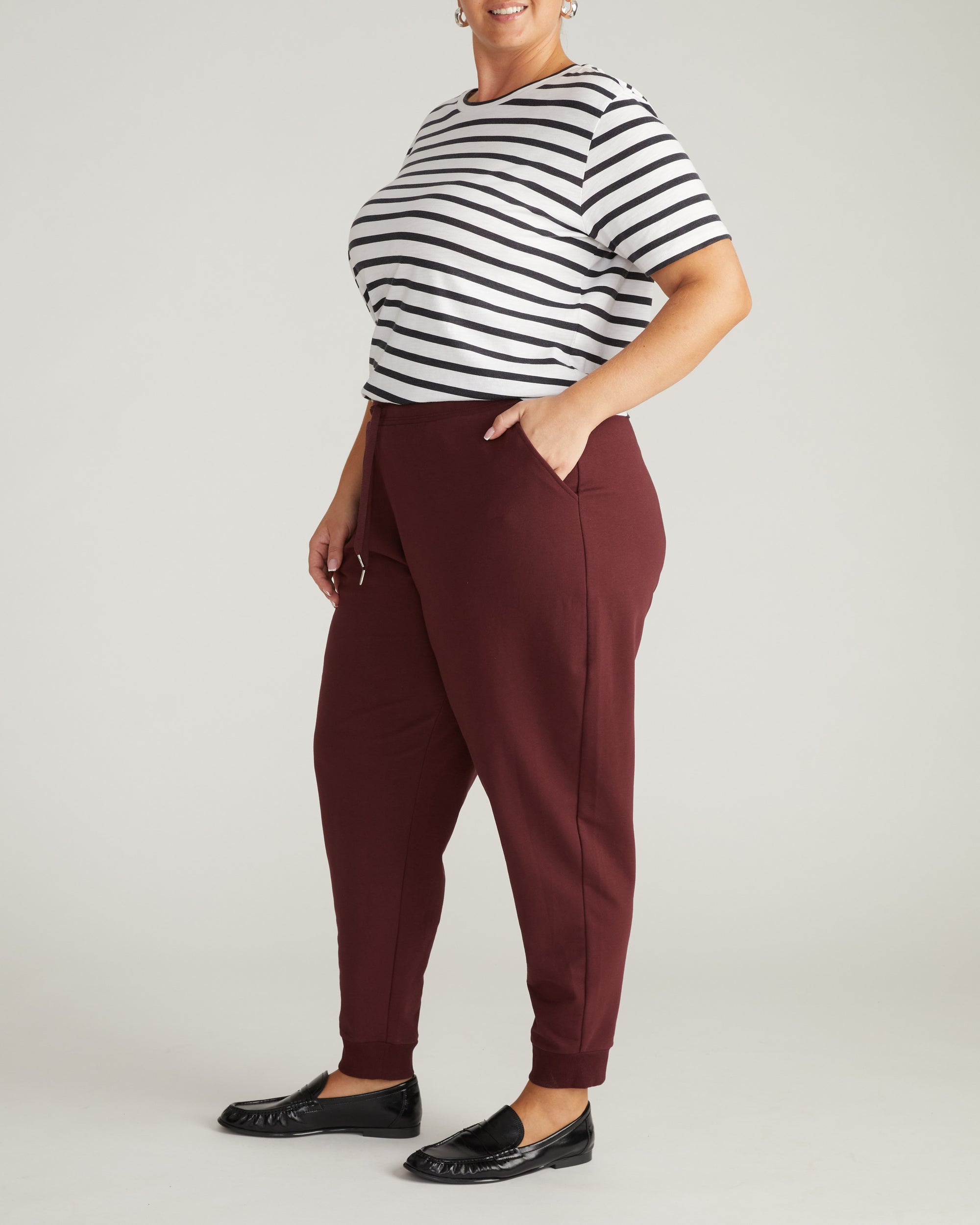 Woman wearing Selma French Terry Jogger - Black Cherry from Universal Standard