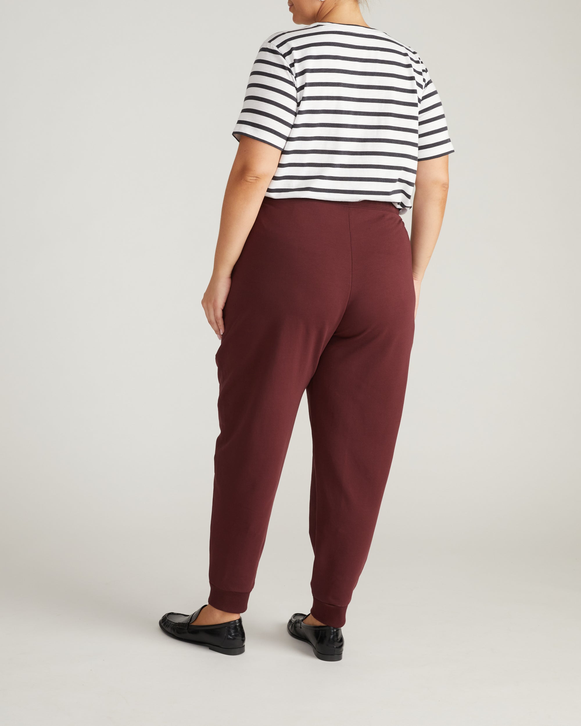 Woman wearing Selma French Terry Jogger - Black Cherry from Universal Standard