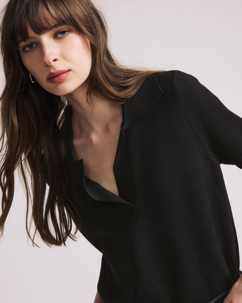 Woman wearing Savvy Fine Knit Short Sleeve Polo Sweater - Black from Universal Standard