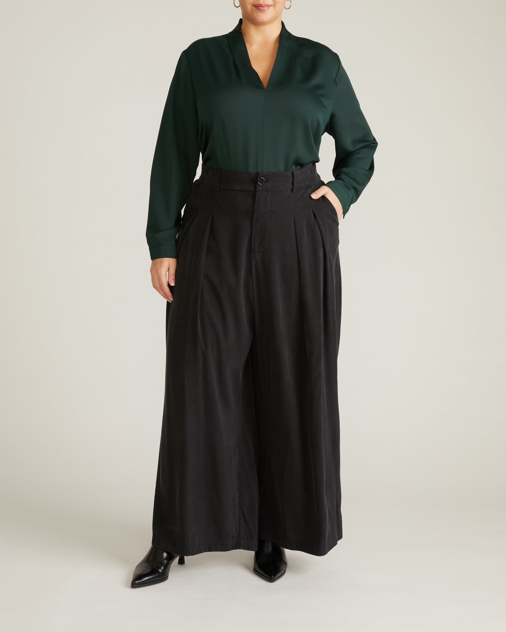 Woman wearing Georgette Satin Cambria Blouse - Forest Green from Universal Standard