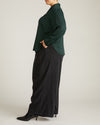 Woman wearing Georgette Satin Cambria Blouse - Forest Green from Universal Standard