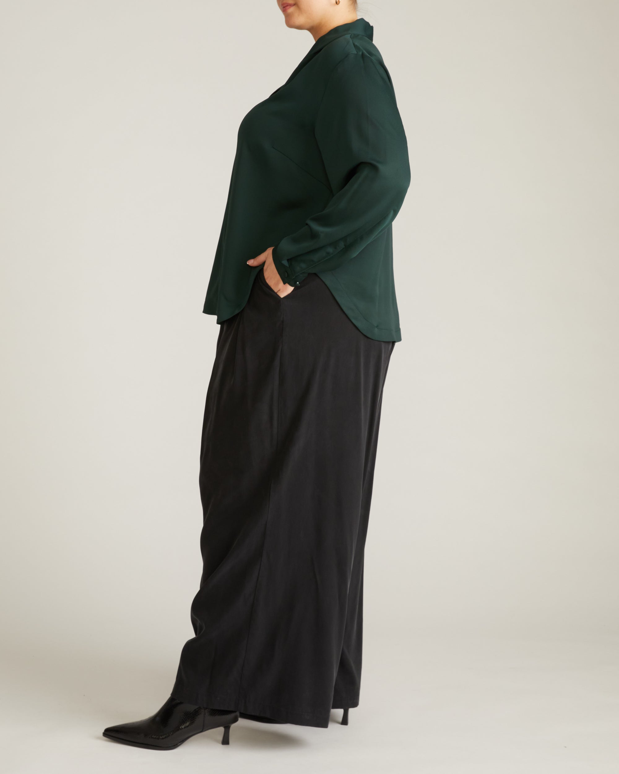 Woman wearing Georgette Satin Cambria Blouse - Forest Green from Universal Standard