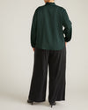 Woman wearing Georgette Satin Cambria Blouse - Forest Green from Universal Standard