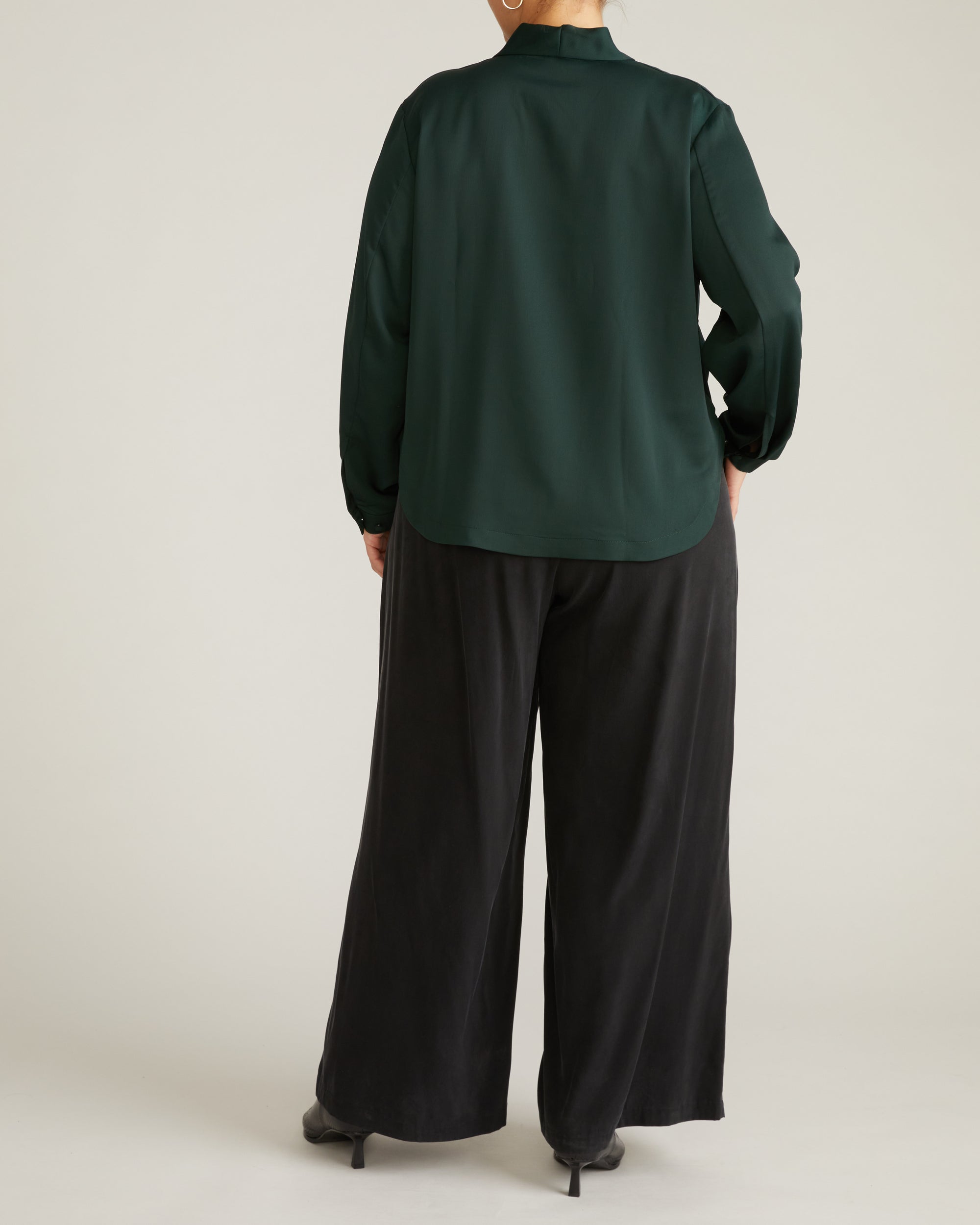 Woman wearing Georgette Satin Cambria Blouse - Forest Green from Universal Standard
