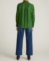 Woman wearing Elbe Stretch Linen Shirt - Green Park from Universal Standard