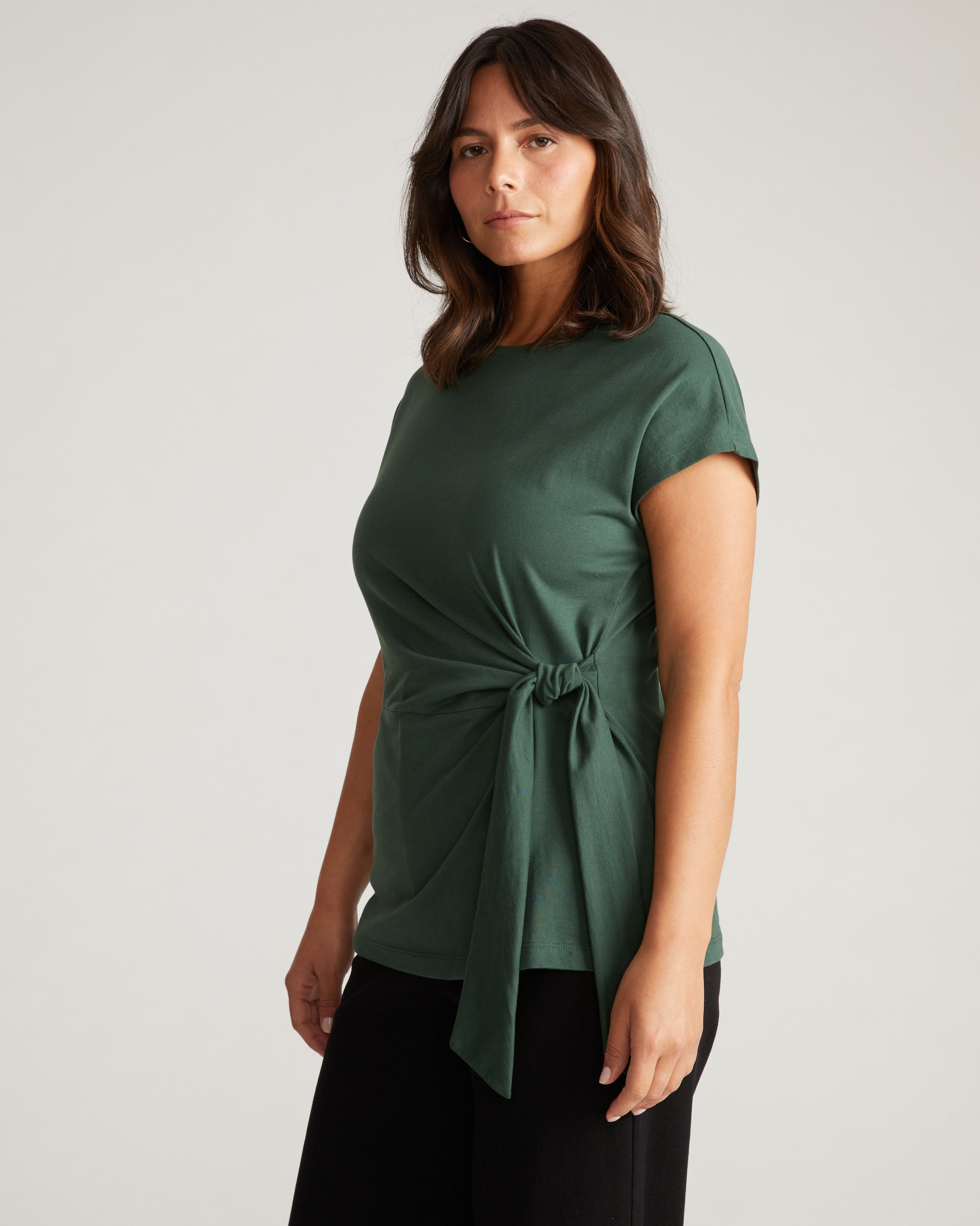 Woman wearing Crescent Breton Stripe Knot Tee - Solid Conifer from Universal Standard