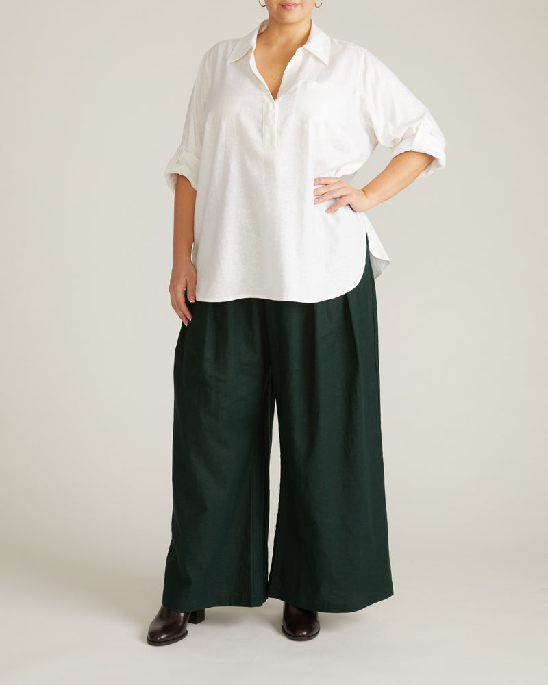 Woman wearing Button Back Linen Polo Shirt - Bright White from Universal Standard