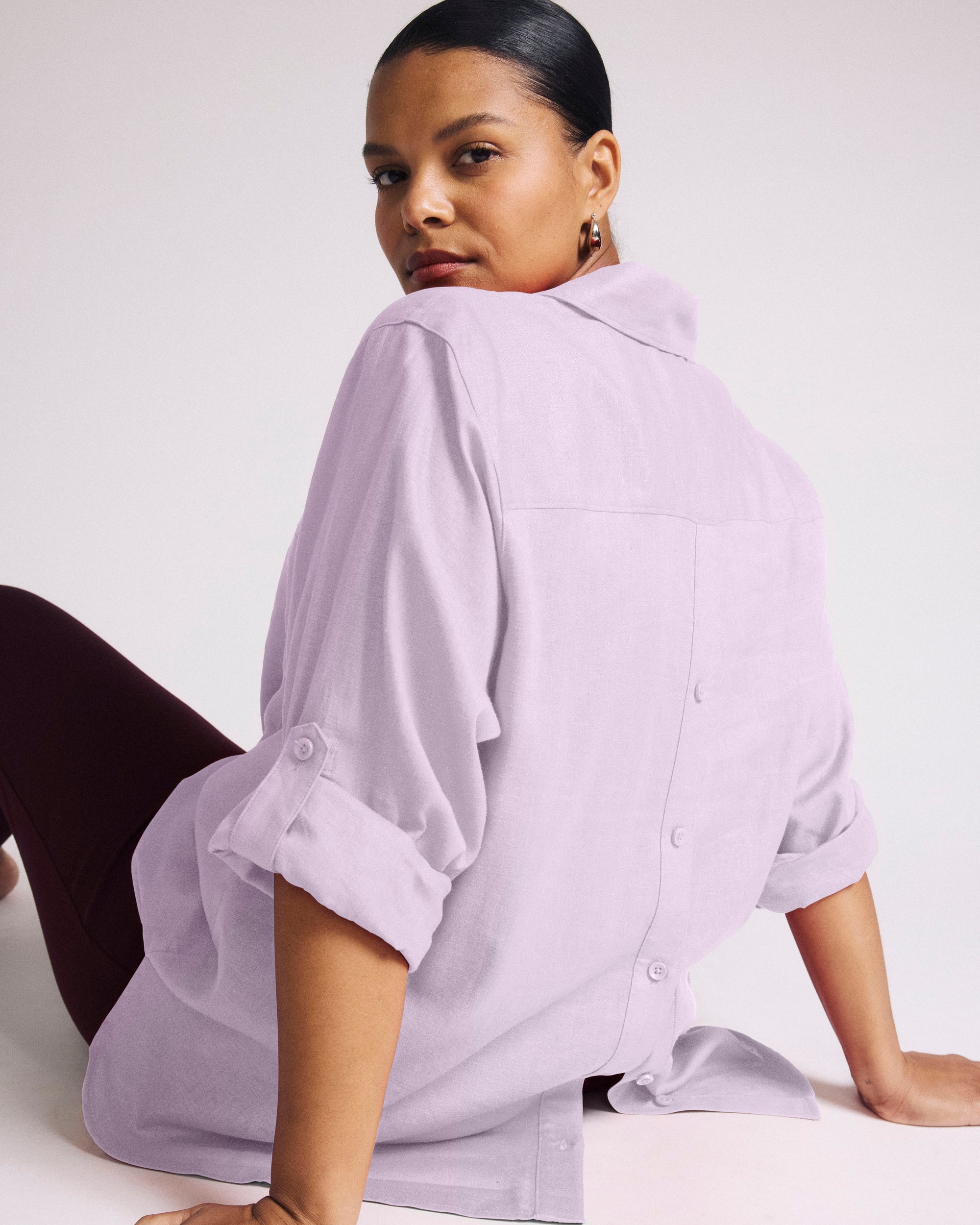 Woman wearing Button Back Linen Polo Shirt - Orchid from Universal Standard