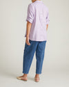 Woman wearing Button Back Linen Polo Shirt - Orchid from Universal Standard