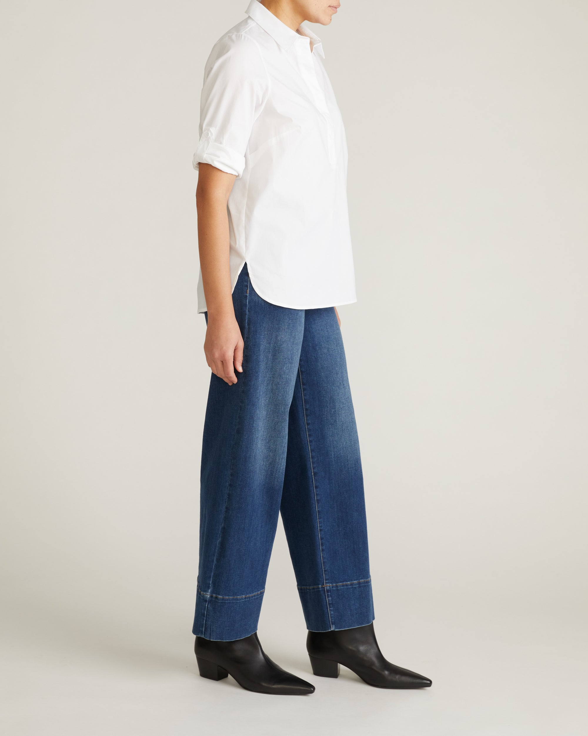 Woman wearing Button Back Poplin Polo Shirt - White from Universal Standard