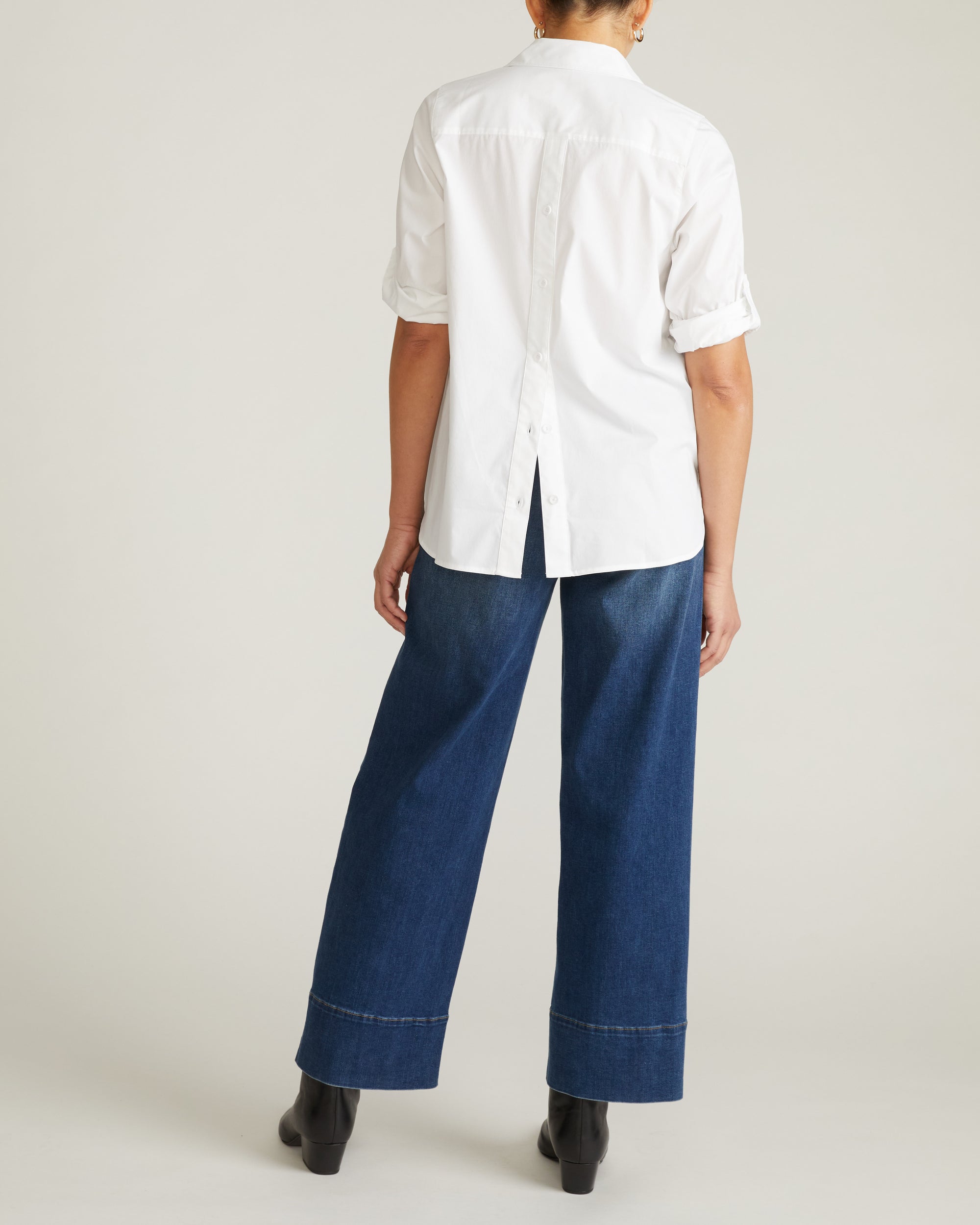 Woman wearing Button Back Poplin Polo Shirt - White from Universal Standard