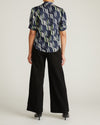 Woman wearing Beatrice Soft Satin Top - Paddington Ribbon Print from Universal Standard