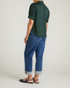 Woman wearing Beatrice Soft Satin Top - Forest Green from Universal Standard