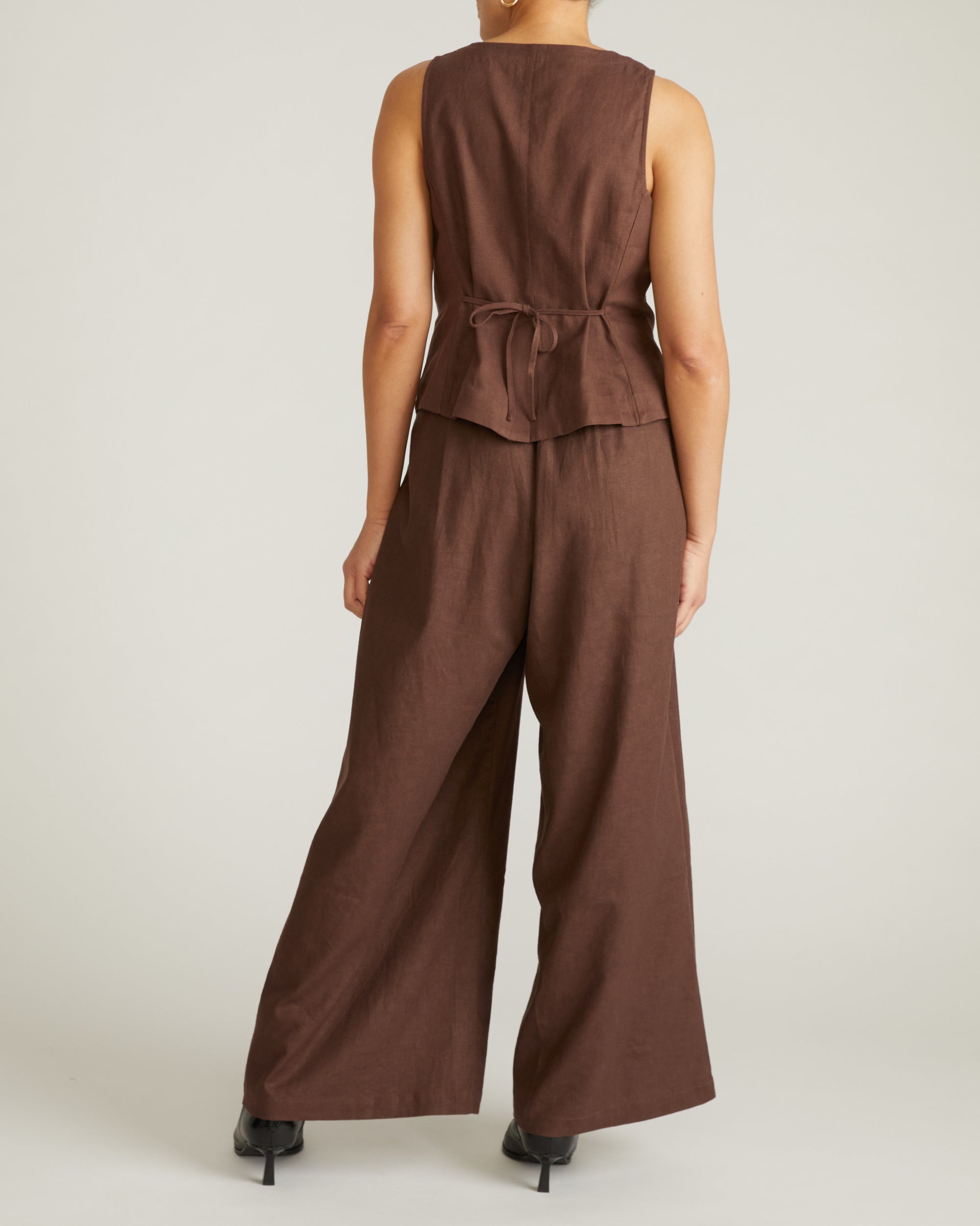 Woman wearing Tamsin Stretch Linen Vest - Sophisticated Brown from Universal Standard