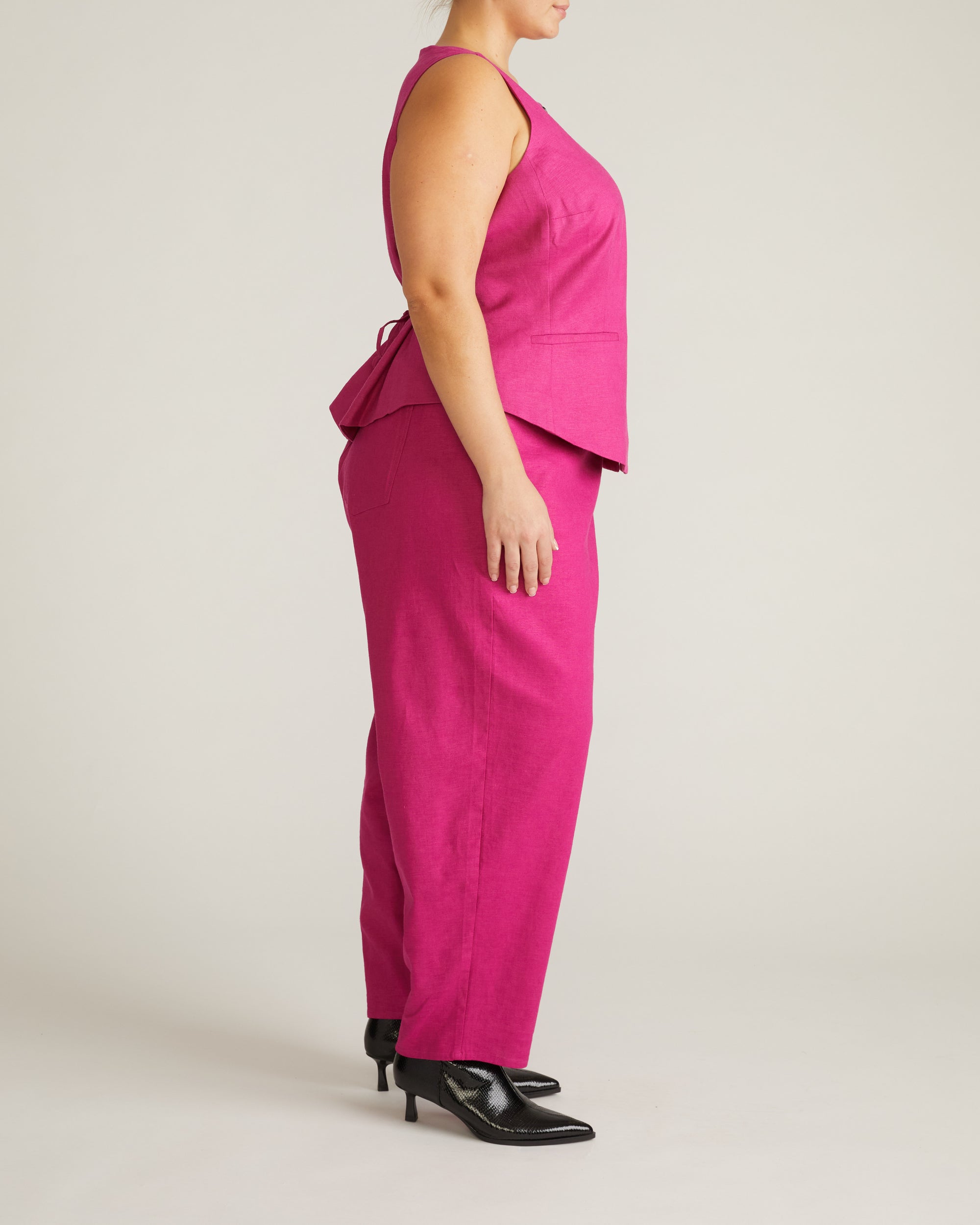 Woman wearing Tamsin Stretch Linen Vest - Hyper Pink from Universal Standard