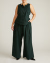 Woman wearing Tamsin Stretch Linen Vest - Forest Green from Universal Standard