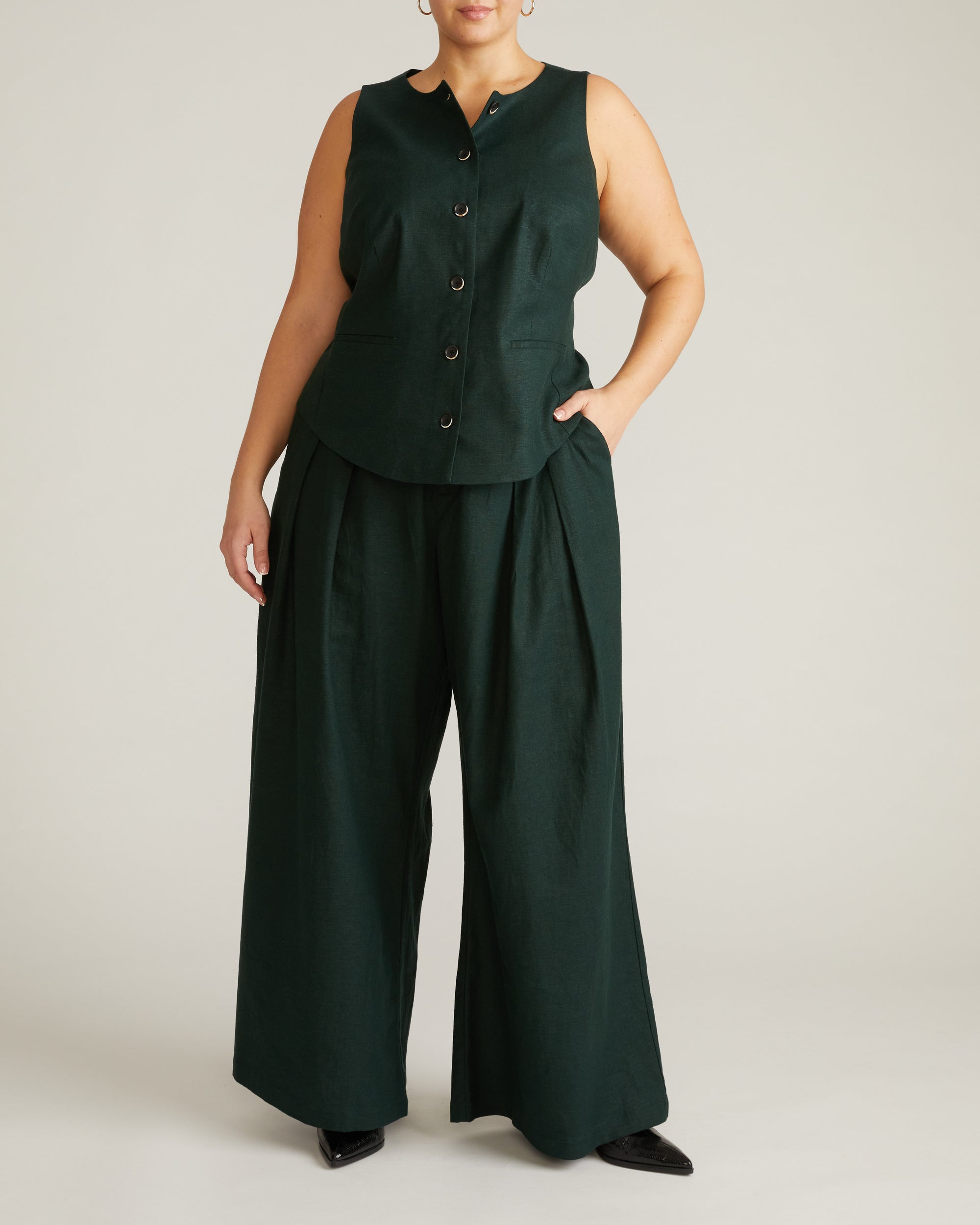 Woman wearing Tamsin Stretch Linen Vest - Forest Green from Universal Standard