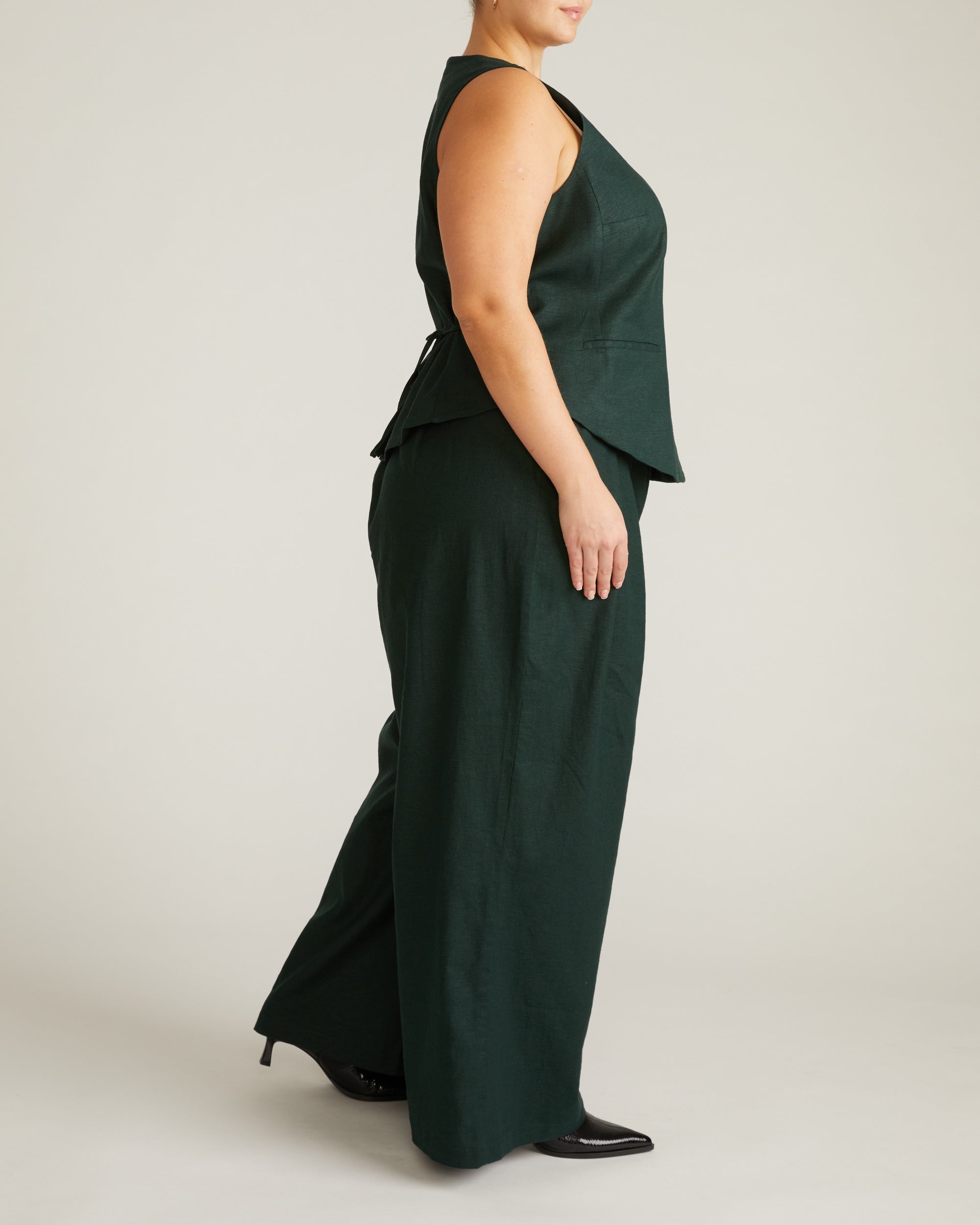 Woman wearing Tamsin Stretch Linen Vest - Forest Green from Universal Standard
