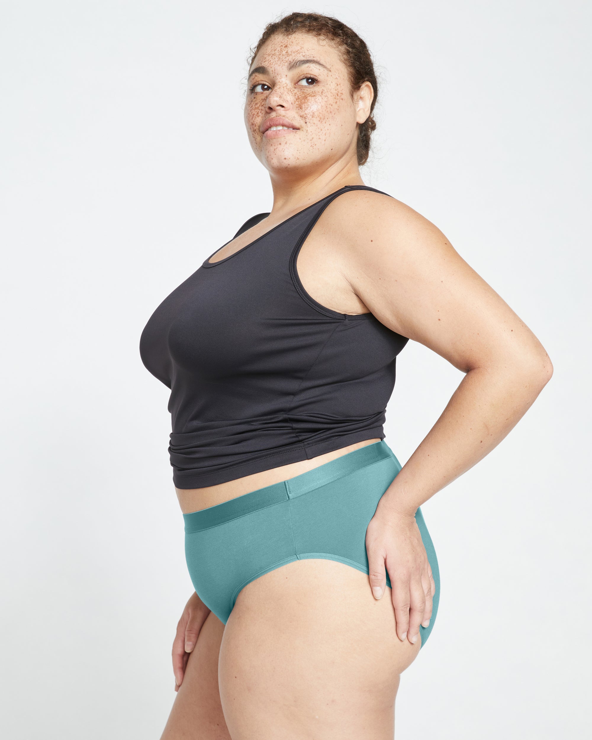 Woman wearing UltimateS Mid Rise Bikini - Libertas from Universal Standard