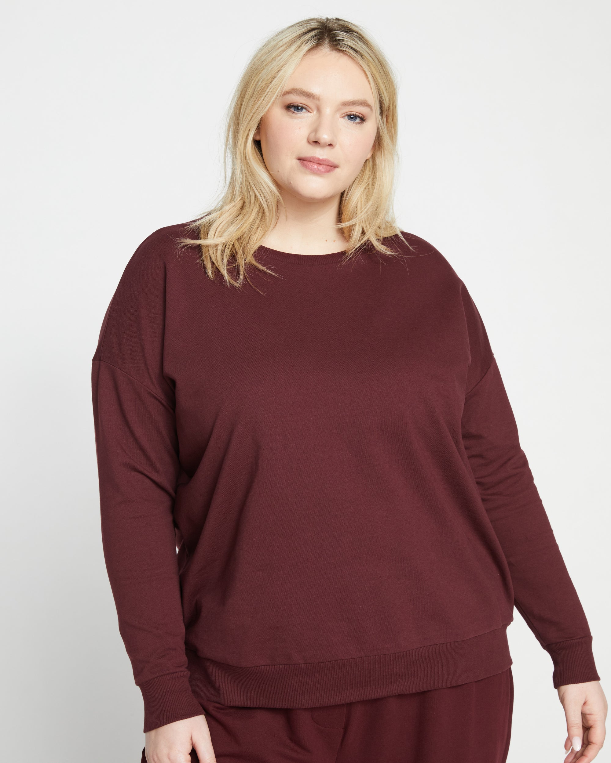Woman wearing Lauren Classic Sweatshirt - Black Cherry from Universal Standard