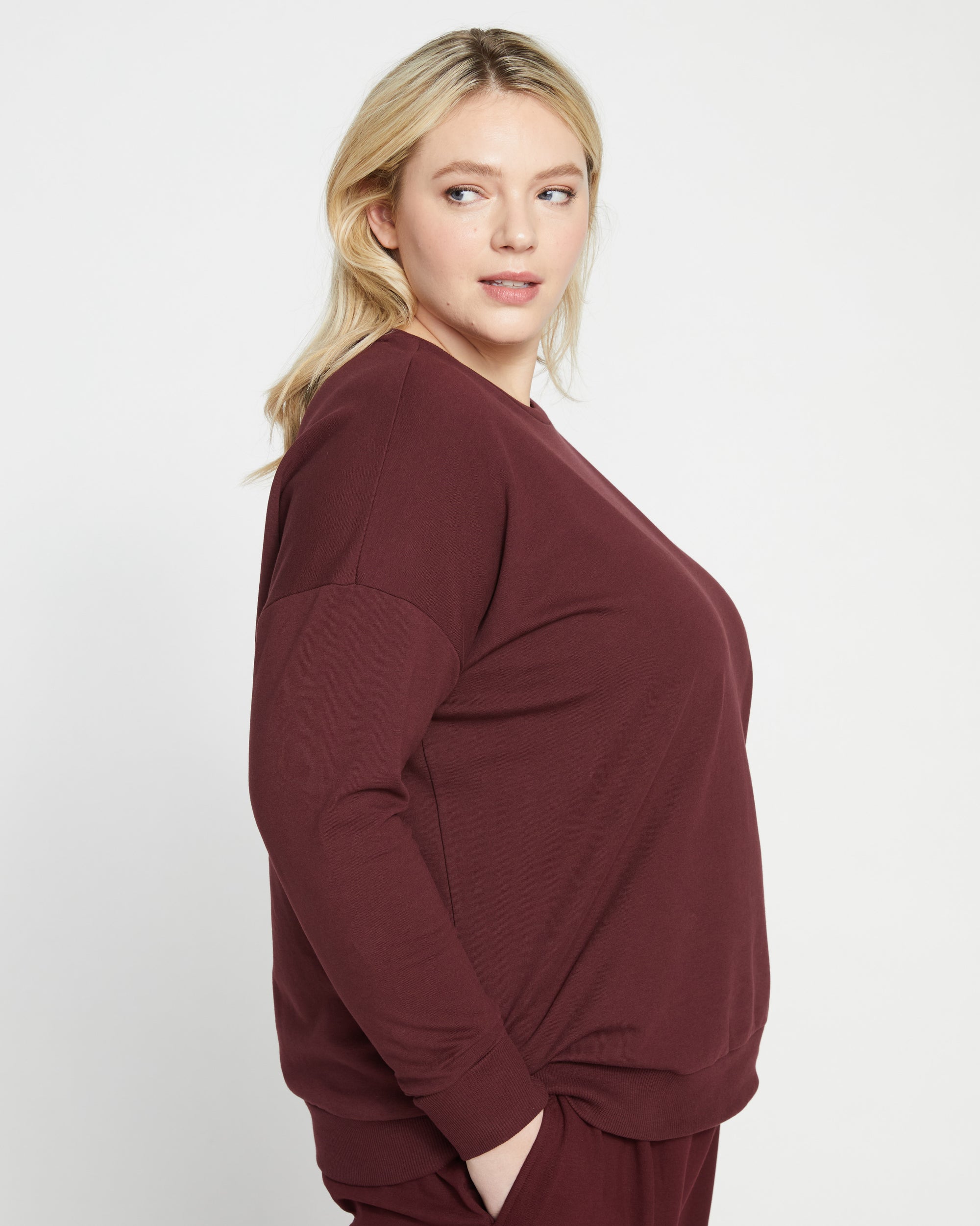 Woman wearing Lauren Classic Sweatshirt - Black Cherry from Universal Standard