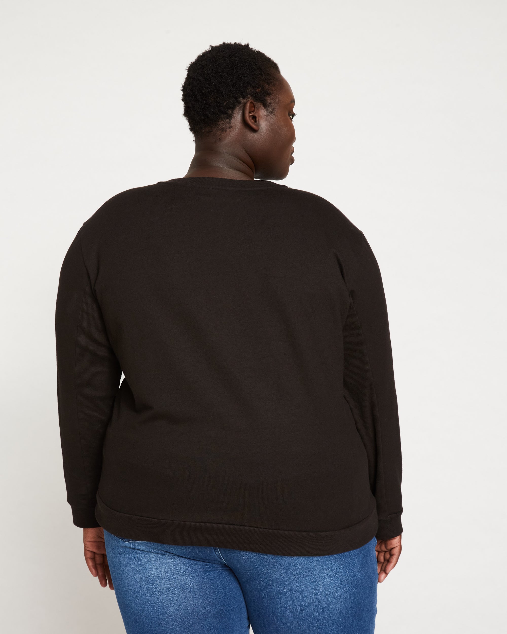 Woman wearing Meridien Zip Sweatshirt - Black from Universal Standard