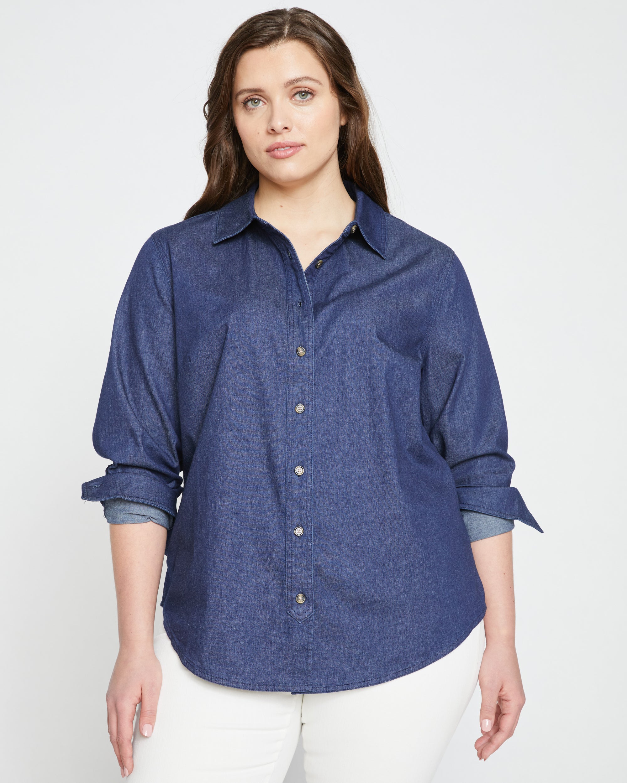 Woman wearing Minimalist Stretch Cotton Chambray Shirt - Dark Indigo from Universal Standard