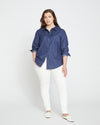 Woman wearing Minimalist Stretch Cotton Chambray Shirt - Dark Indigo from Universal Standard