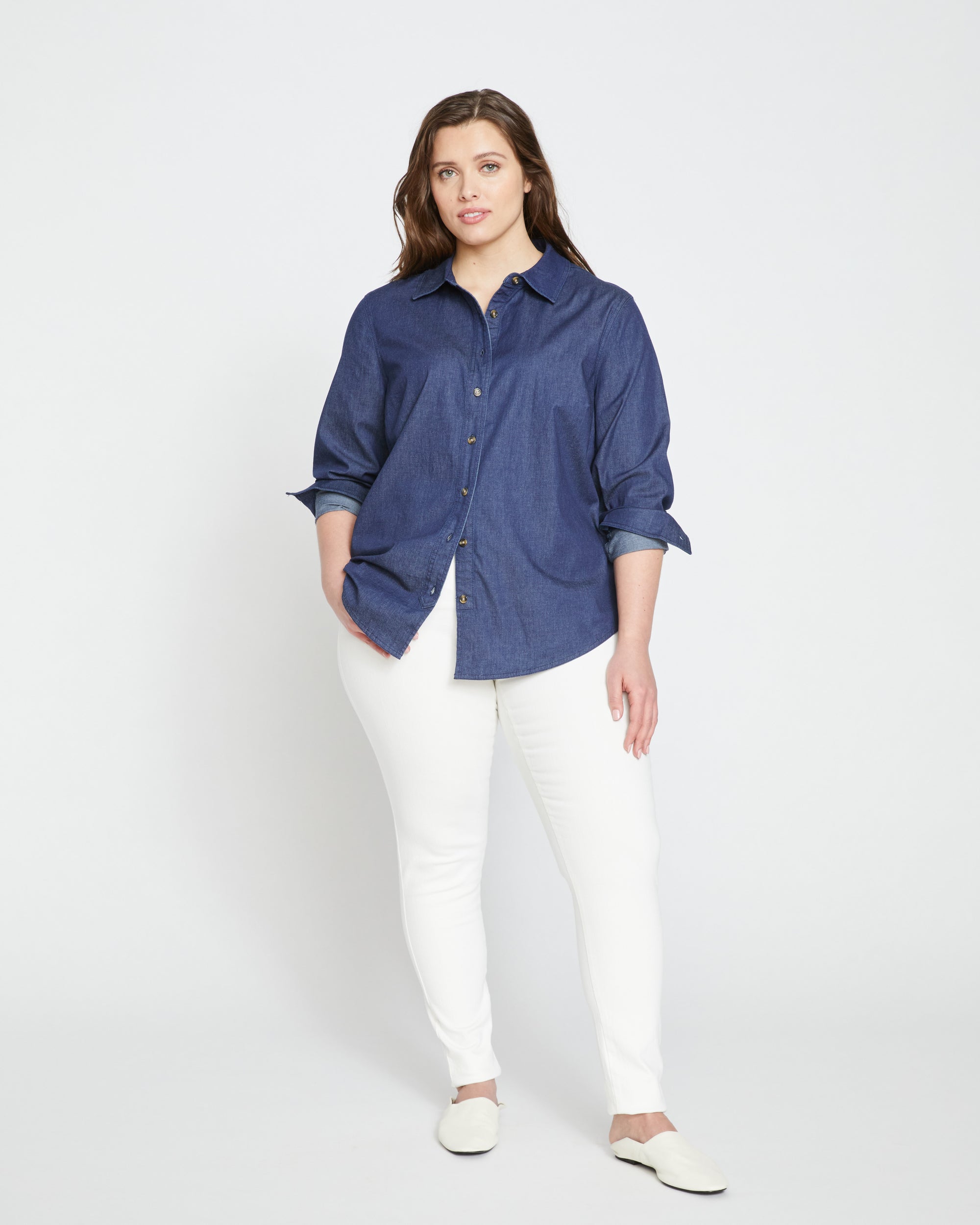Woman wearing Minimalist Stretch Cotton Chambray Shirt - Dark Indigo from Universal Standard