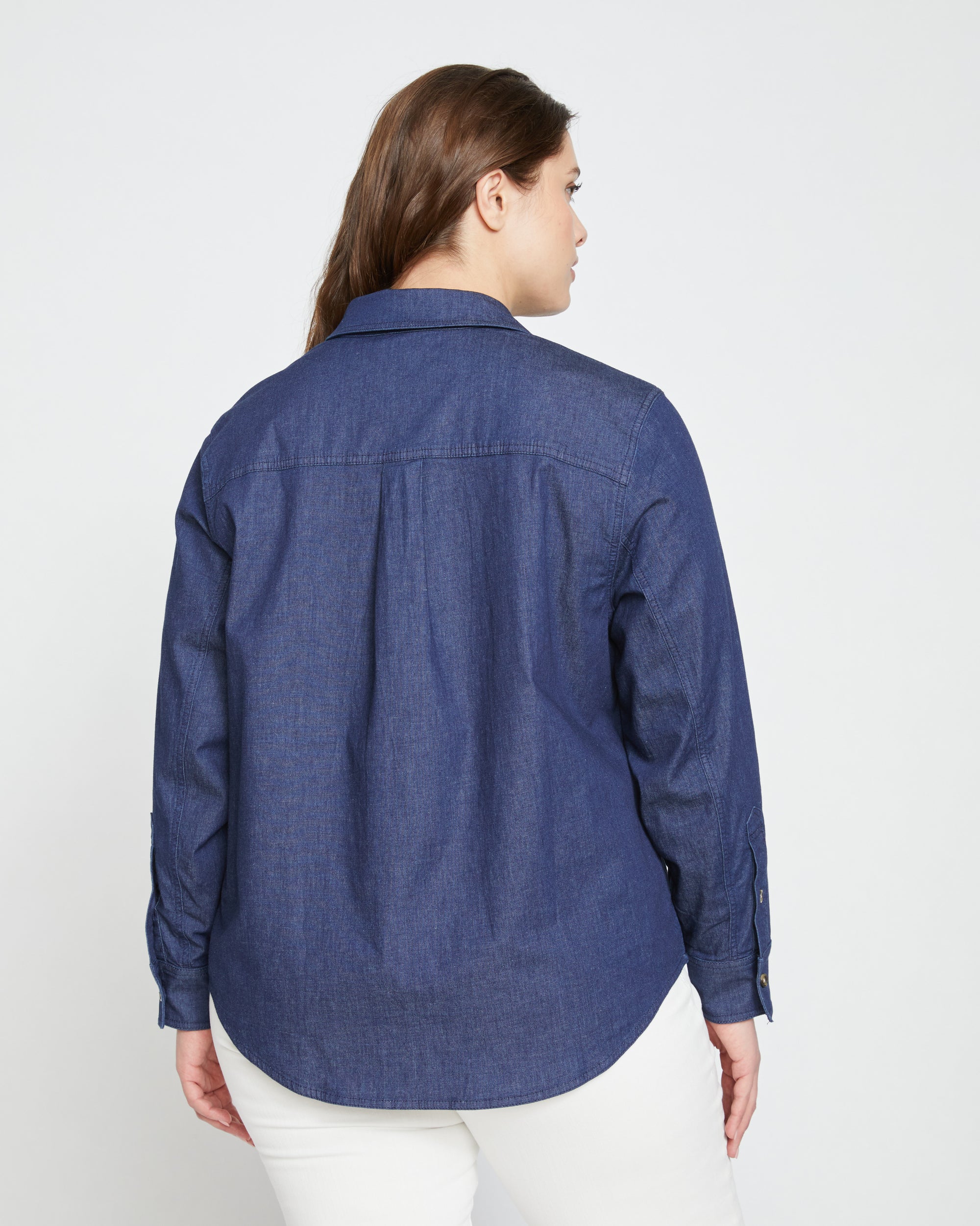 Woman wearing Minimalist Stretch Cotton Chambray Shirt - Dark Indigo from Universal Standard