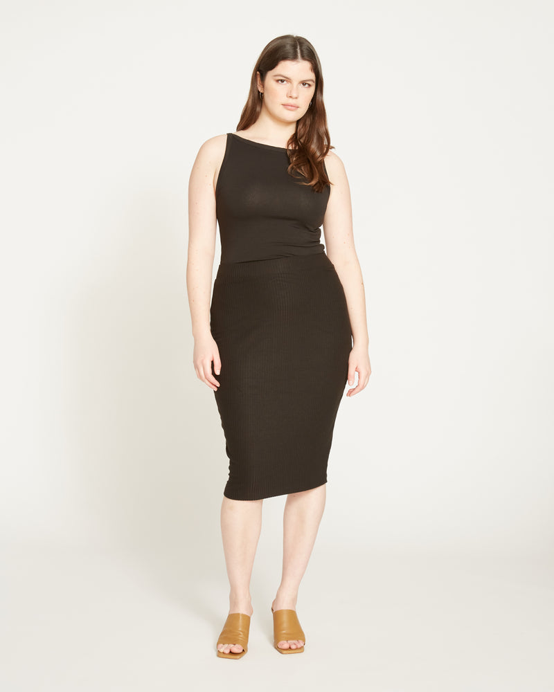 Woman wearing Le Bon Ribbed Skirt - Black from Universal Standard
