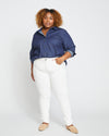 Woman wearing Minimalist Stretch Cotton Chambray Shirt - Dark Indigo from Universal Standard